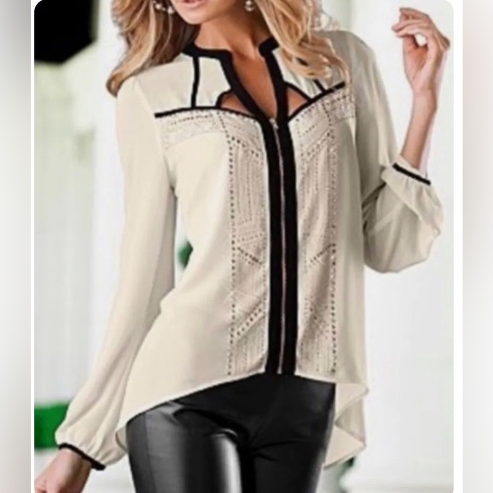 Cream blouse with black trim and embellishment. Has a cut out in the back. Sz S